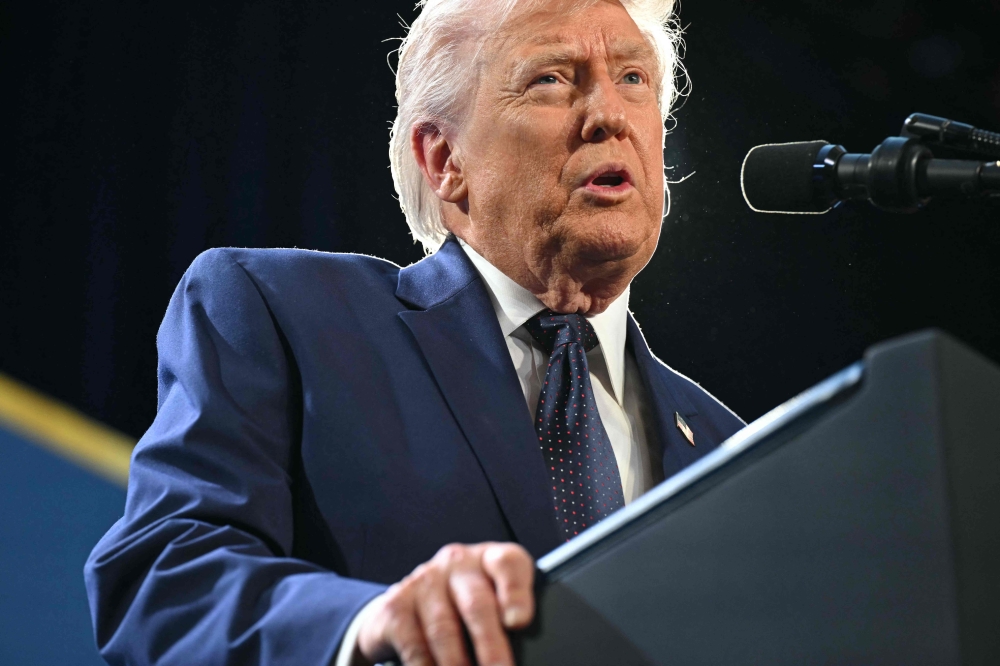 US President Donald Trump speaks during the Republican Members' Issues Conference at Trump National Doral in Miami, Florida, yesterday. — AFP pic