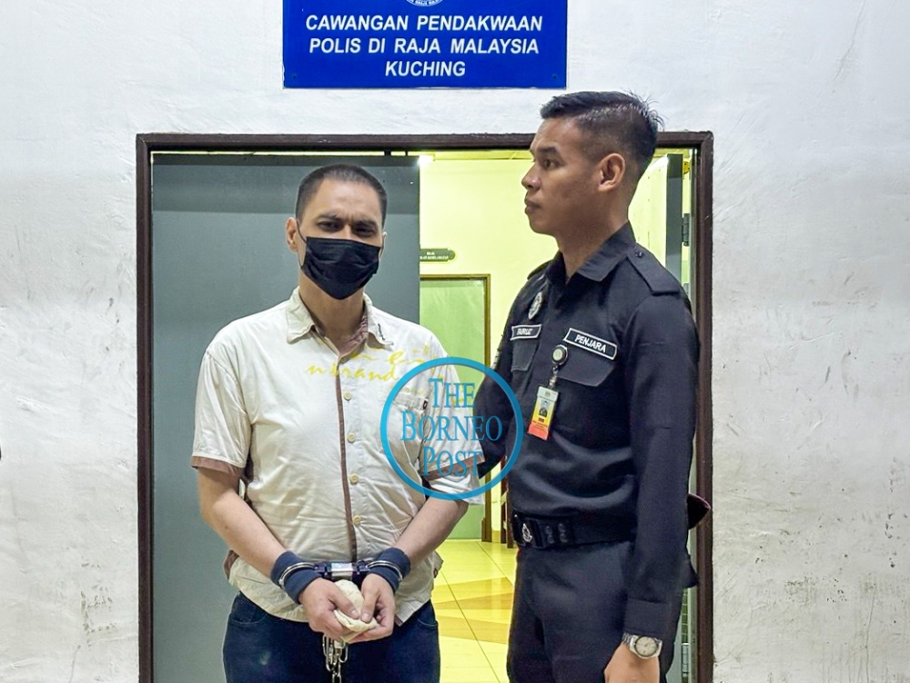 Cheung is seen at the Kuching Court Complex. — The Borneo Post pic