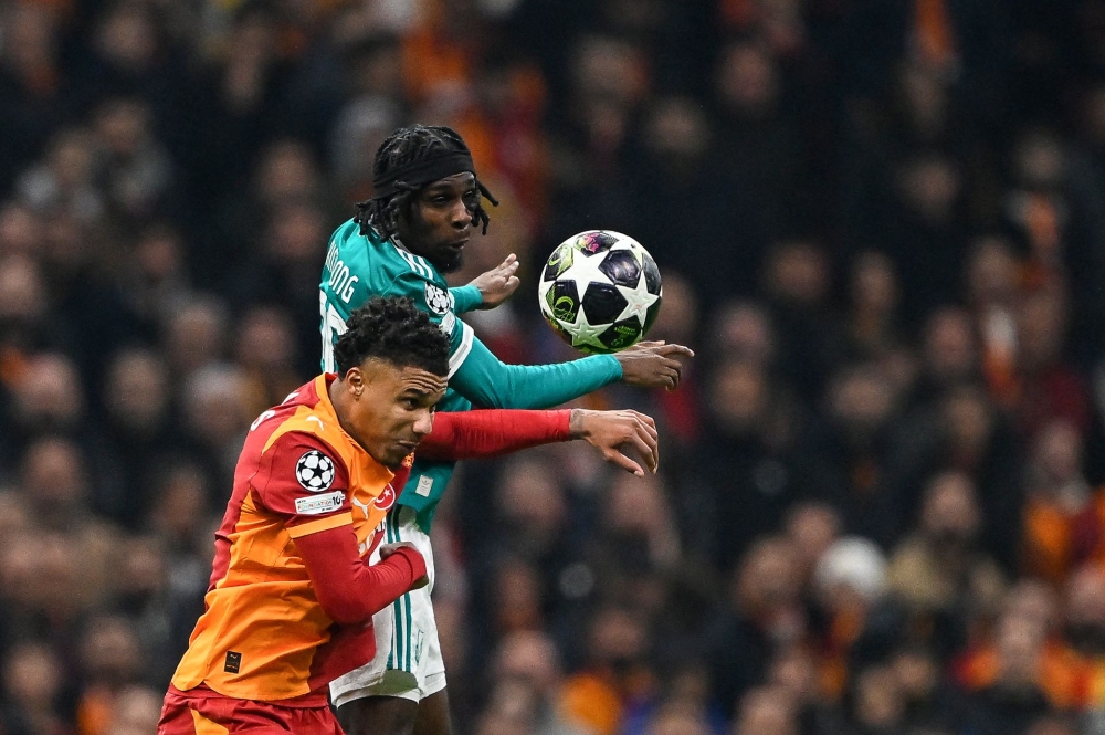 Galatasaray's Senegalese defender Ismail Jakobs (L) and Liverpool's Dutch defender Jeremie Frimpong clash during the Uefa Champions League round of 16 first leg match. — AFP pic
