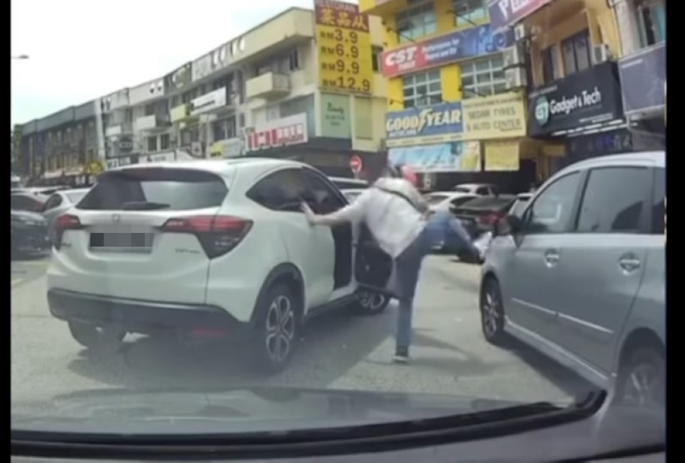 Earlier, a video circulated online showing a man driving a Honda HR-V getting out of his vehicle before damaging another car’s side mirror and leaving the scene. — Screengrab from TikTok