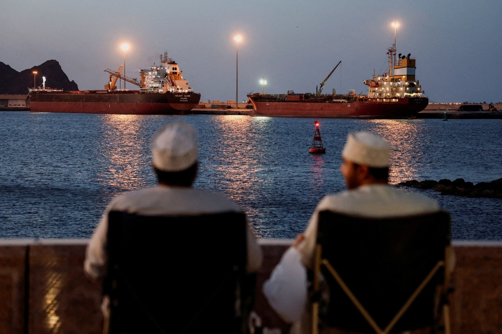 The Galaxy Globe bulk carrier and the Luojiashan tanker sit anchored as Iran vows to close the Strait of Hormuz, amid the US-Israeli conflict with Iran, in Muscat, Oman, March 9, 2026. — Reuters pic