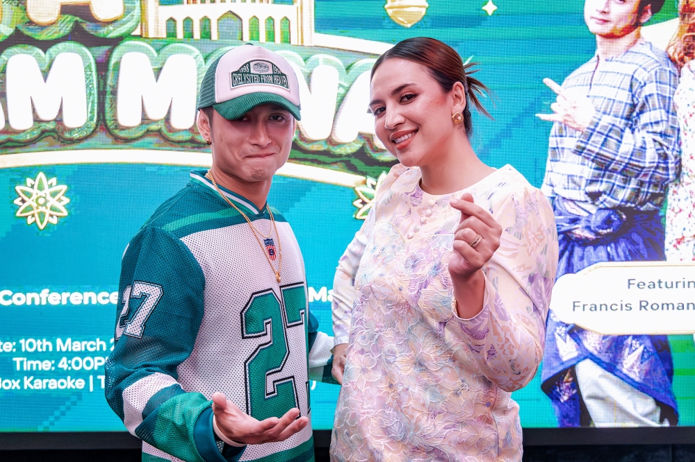 Actress and singer Diana Danielle (right) and local rapper Francis Roman (left) have teamed up to produce their own Raya song this year. — Picture by Firdaus Latif