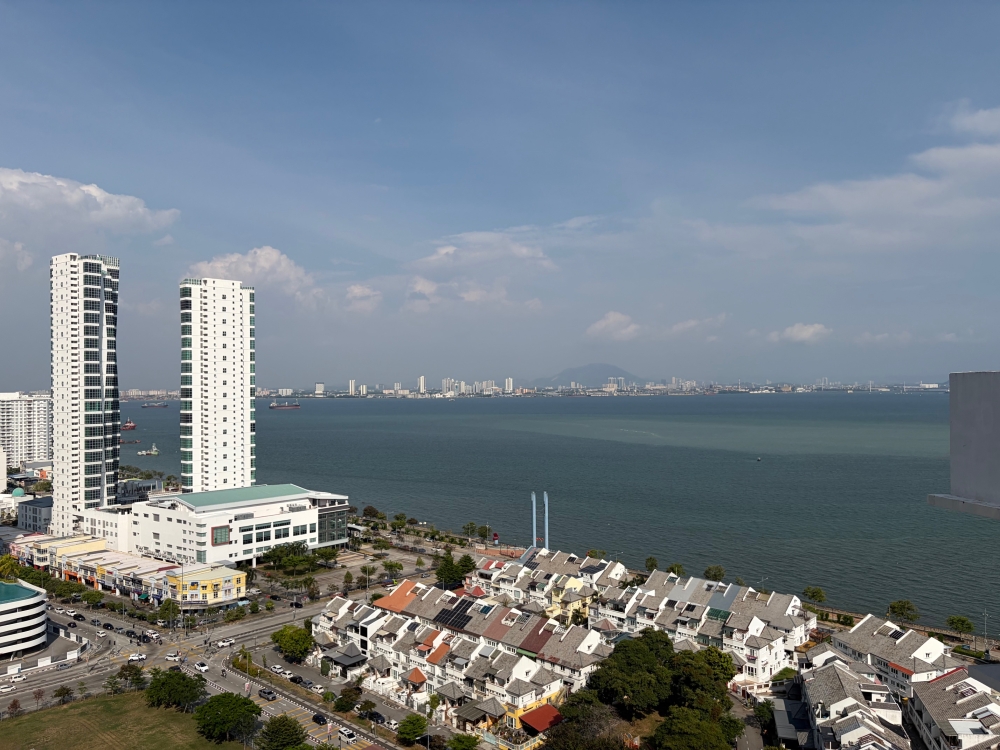The jelutong landfill rehabilitation and Karpal Singh Drive coastal reclamation project stretches 30ha off this coast. — Picture by Opalyn Mok