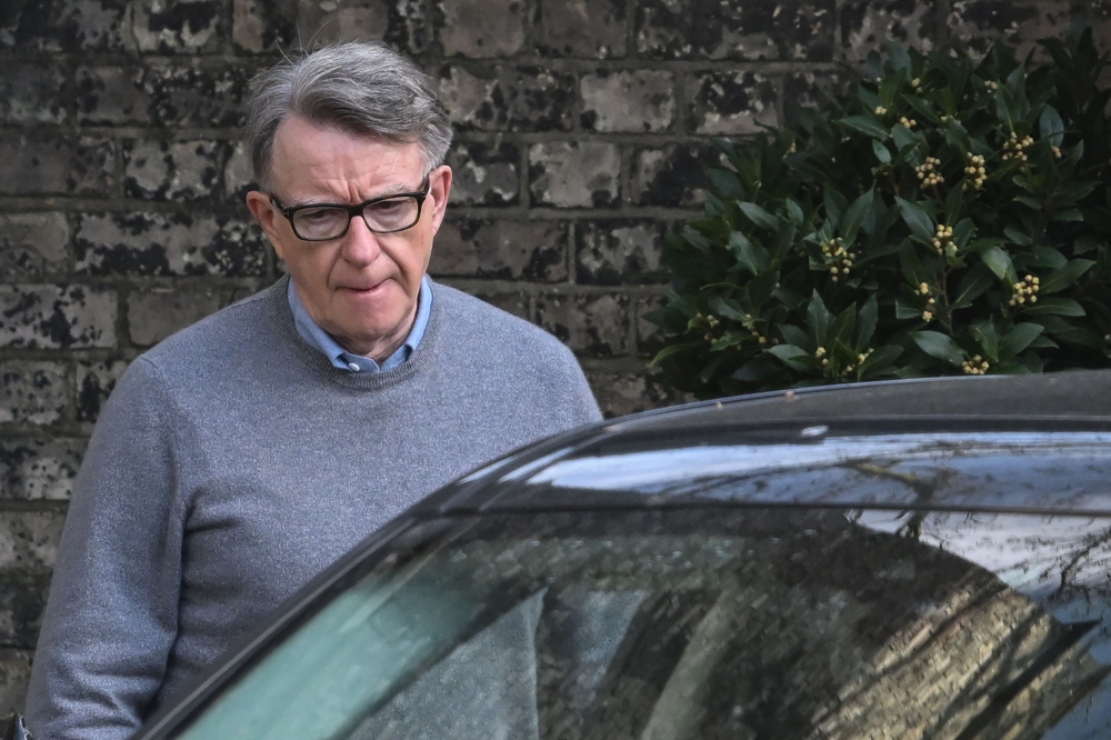Former UK ambassador to the United States, Peter Mandelson, gets into a car outside his residence in central London on March 11, 2026. Mandelson faces a criminal investigation over claims he shared confidential information with late US sex offender Jeffrey Epstein nearly two decades ago. — AFP pic 