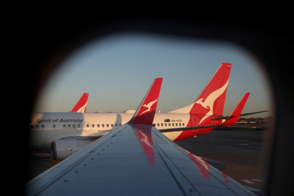 A Qantas logo is visible on the tail of an aeroplane at an airport in Sydney September 18, 2025. — Reuters pic