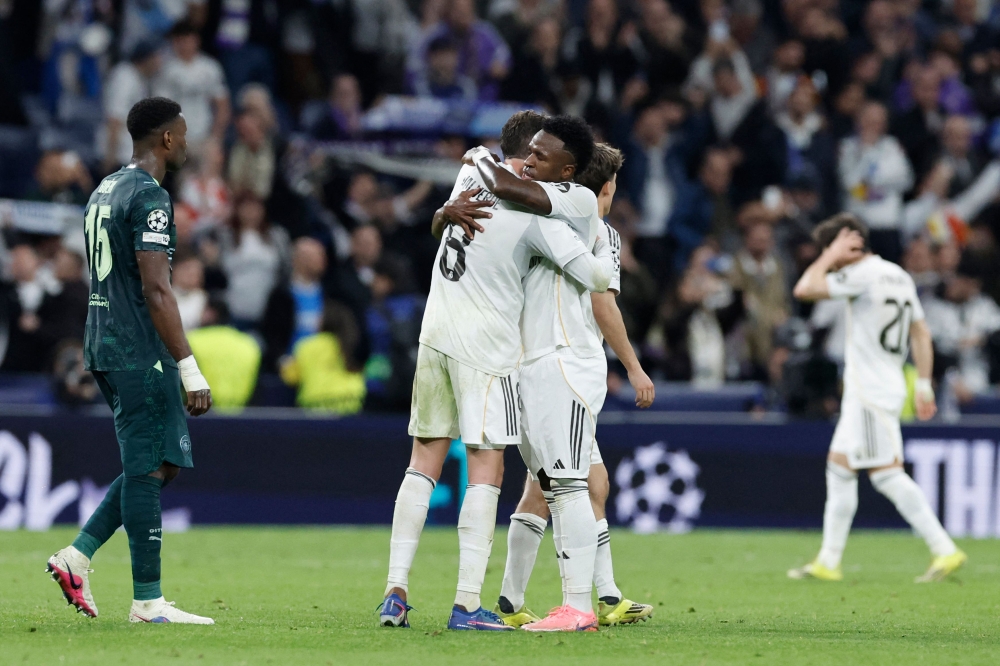Real Madrid CF players celebrate after defeating Manchester City FC in the Uefa Champions League last-16 first-leg match at Santiago Bernabéu Stadium in Madrid on March 11, 2026. — AFP pic