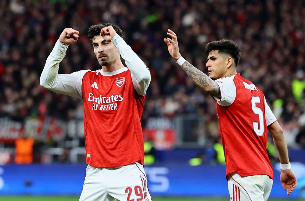 Kai Havertz of Arsenal FC celebrates scoring his team’s first goal with Piero Hincapié during the Uefa Champions League round-of-16 first-leg match between Bayer 04 Leverkusen and Arsenal at the BayArena in Leverkusen, Germany, on March 11, 2026. — Reuters pic