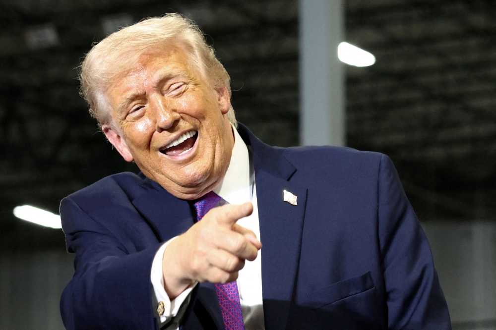 Donald Trump gestures during a visit to Verst Logistics in Hebron, Kentucky, US, on March 11, 2026. — Reuters pic