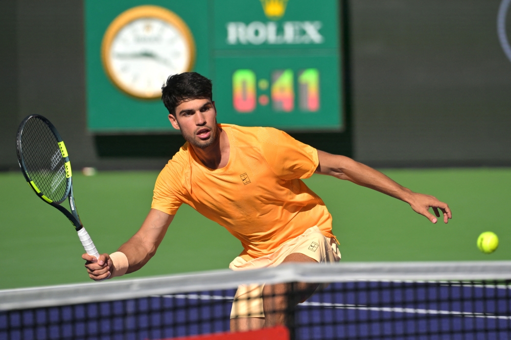 Carlos Alcaraz hits a shot against Casper Ruud during the fourth round of the BNP Paribas Open at Indian Wells Tennis Garden in Indian Wells, California, on March 11, 2026. — Reuters pic
