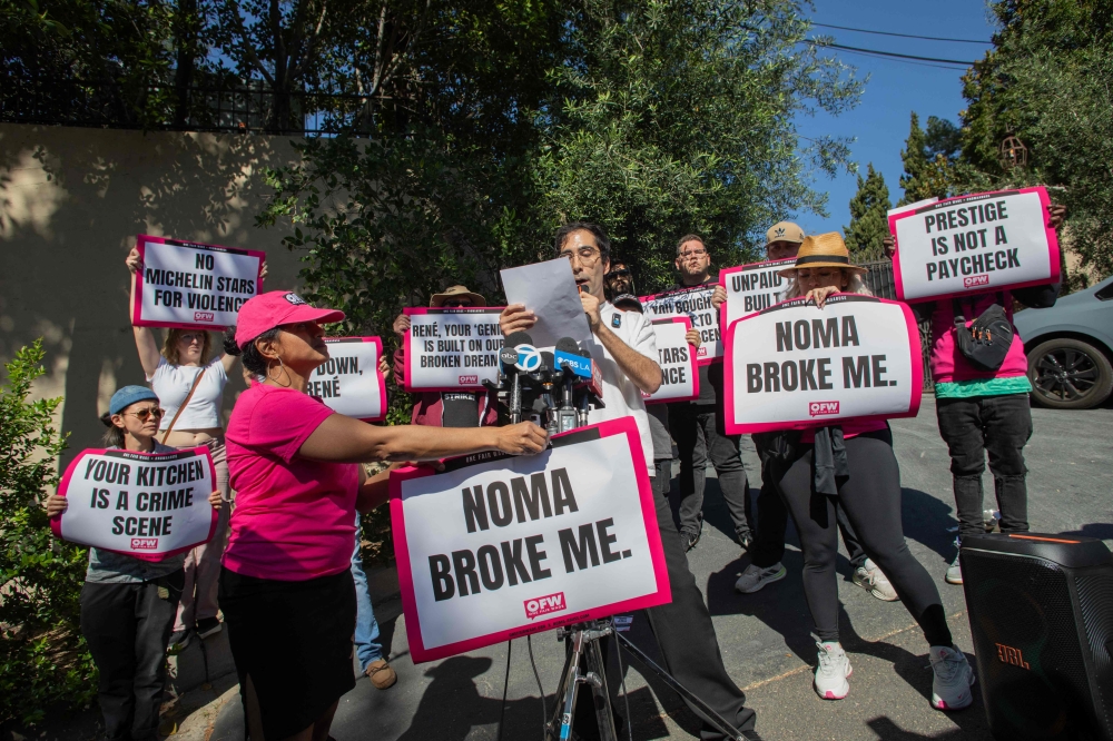 Clients arrive in luxury SUVs while activists and restaurant workers gather in front of Danish chef Rene Redzepi's Noma Restaurant's pop-up in Los Angeles on March 11, 2026. — AFP pic