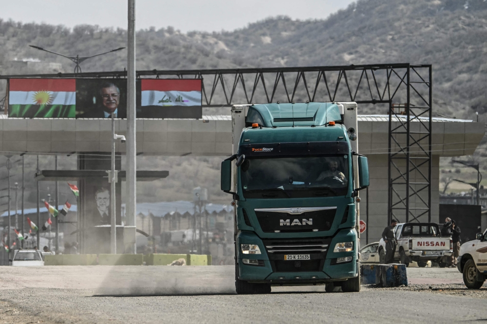 A truck drives at the Iraq-Iran border crossing of Bashmagh near Sulaimaniyah in Iraq's autonomous Kurdistan region on March 11, 2026. — AFP pic