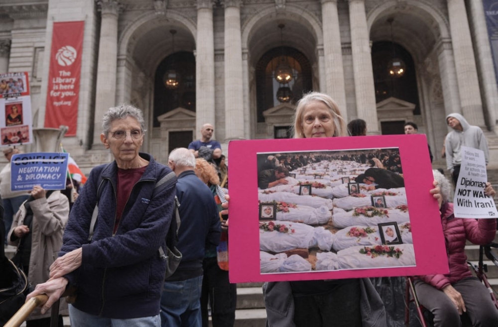 Anti-war protestors gather in front of the New York Public Library and mourn the 180 Iranian children killed during US-Israeli bombing on Shajareh Tayyebeh girls’ elementary school in Minab, Iran, in New York March 8, 2026. — AFP pic