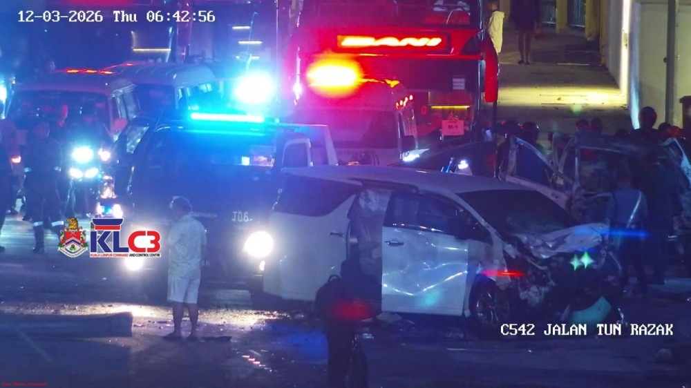 Emergency responders attend to a crash involving a Peugeot and a Toyota Vellfire along Jalan Tun Razak in Kuala Lumpur early March 12, 2026. — KLCCC pic