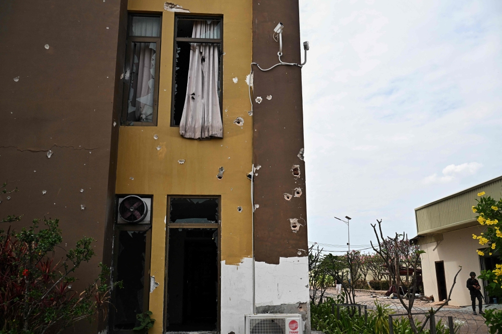 Damage sustained during fighting between Thailand and Cambodia is pictured on the outside of an abandoned scam centre in O’Smach town on the Thai-Cambodian border on March 12, 2026, during a press trip organised by Thailand’s Ministry of Foreign Affairs and the Royal Thai Army. — AFP pic 