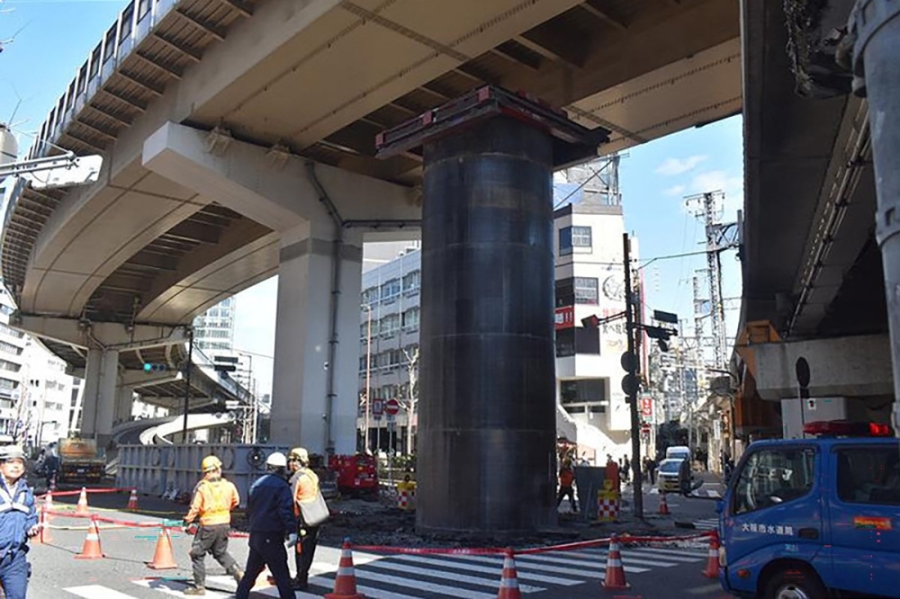 This photo taken on March 11, 2026 shows a scene at a sewage construction site in Osaka City, where a steel pipe has been pushed upward, protruding more than 10 meters above ground level. — AFP pic