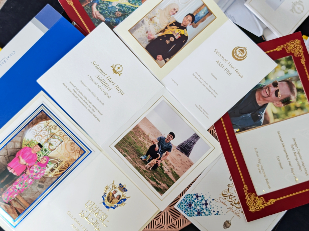 Norain Mohamad Hadi, 34, shows Raya cards she received from dignitaries, including His Majesty Sultan Ibrahim, King of Malaysia, at her home in Bandar Tun Razak, Kuala Lumpur, March 13, 2026. — Bernama pic