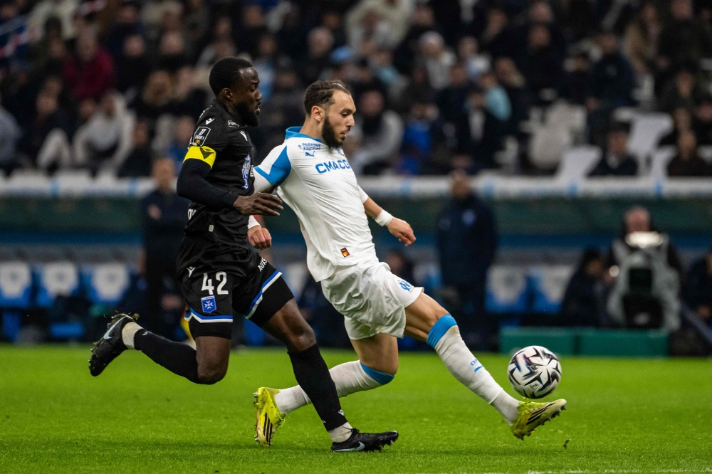 Marseille’s Algerian forward Amine Gouiri (right) challenges Auxerre’s Ghanaian midfielder Elisha Owusu for the ball during the Ligue 1 match at Stade Vélodrome in Marseille, France, March 13, 2026. — AFP pic