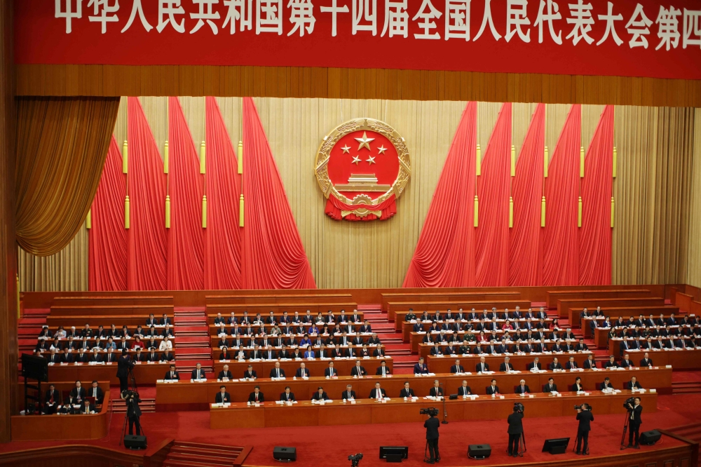 Delegates attend the closing session of the National People’s Congress (NPC) at the Great Hall of the People in Beijing on March 12, 2026. — AFP pic