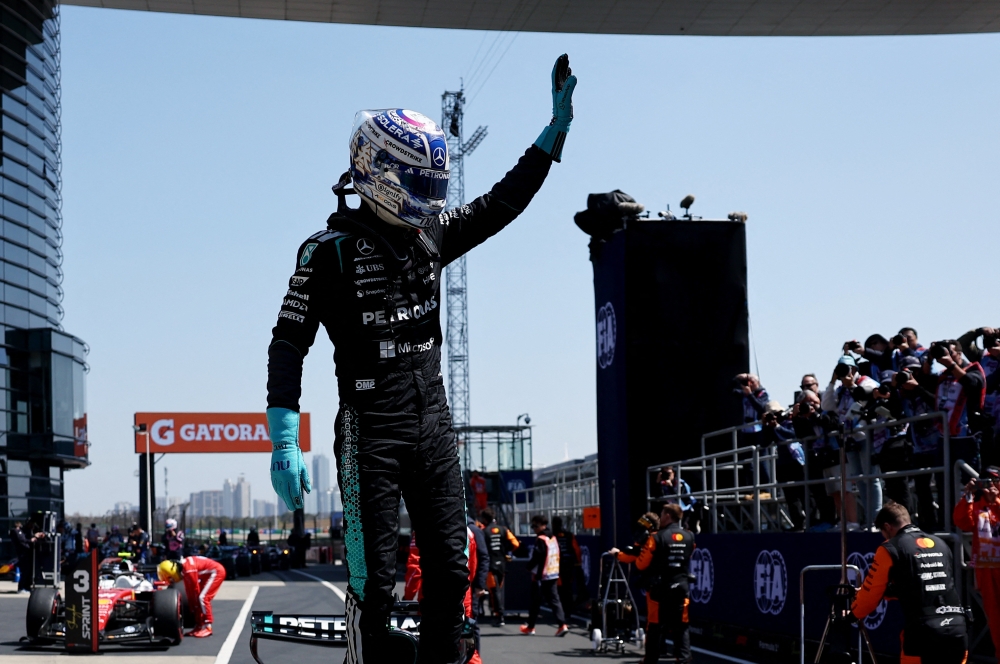 Mercedes driver George Russell celebrates after winning the sprint race at the Formula One Chinese Grand Prix at Shanghai International Circuit in Shanghai, China, March 14, 2026. — Reuters pic