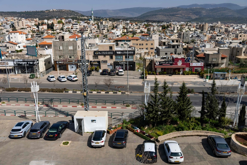 A bomb shelter is seen within a public parking space in the Arab town of Sakhnin in northern Israel near the Lebanese border. — AFP pic