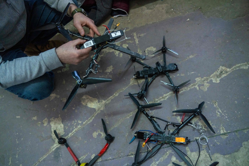 A self-defence unit volunteer shows intercepted Ukrainian FPV drones in Belgorod, the main city of Russia's western Belgorod region bordering Ukraine, on March 12, 2026, amid the ongoing Russian-Ukrainian conflict. — AFP pic