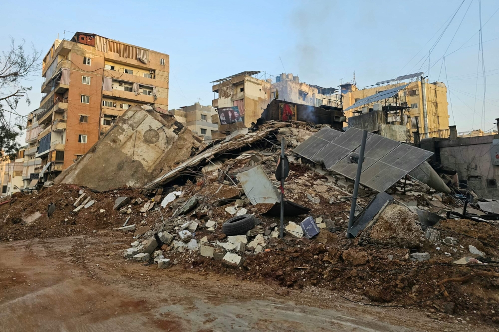 Photovoltaic panels lie atop the debris of a building following an overnight Israeli airstrike that targeted Beirut’s southern suburbs Mreijeh neighborhood on March 13, 2026. — AFP pic