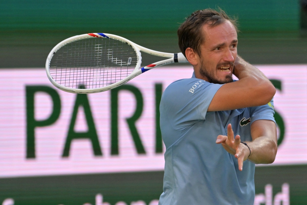 Daniil Medvedev (RUS) hits a shot in his semifinal match defeating Carlos Alcaraz (ESP) in the BNP Paribas Open at the Indian Wells Tennis Garden March 14, 2026. — Jayne Kamin-Imagn Images/Reuters pic 
