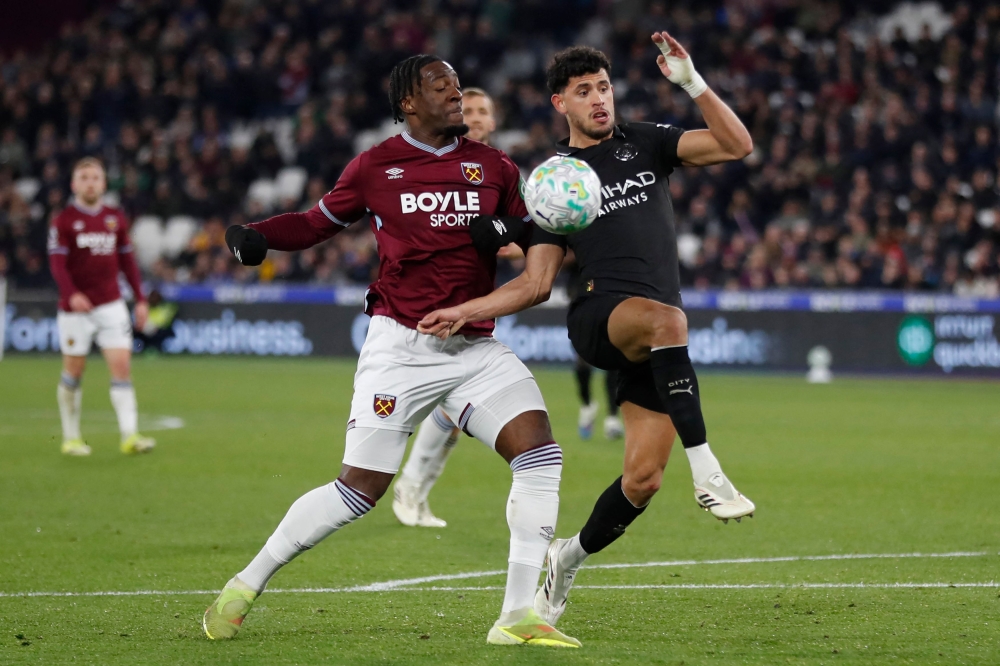 West Ham United's French defender #04 Axel Disasi (left) vies with Manchester City's Portuguese midfielder #27 Matheus Nunes (right) during the English Premier League football match between West Ham United and Manchester City at the London Stadium, in east London on March 14, 2026. — AFP pic 