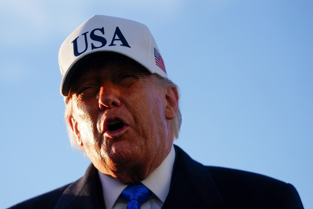 US President Donald Trump speaks to reporters before boarding Air Force One at Joint Base Andrews, Maryland, March 13, 2026, en route to Florida to spend the weekend at his Mar-a-Lago resort. — AFP pic