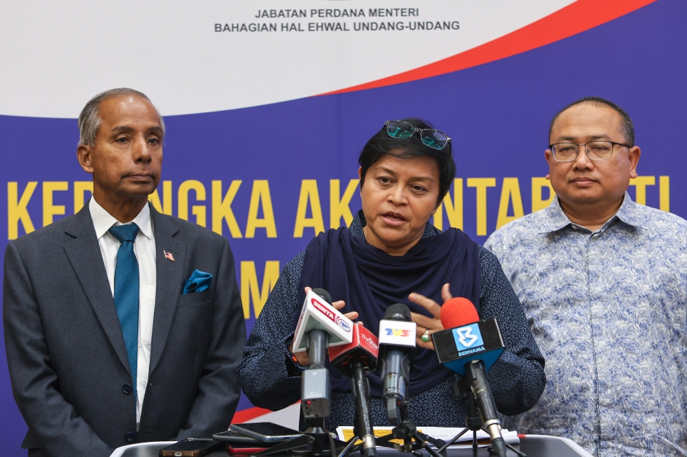 Minister in the Prime Minister's Department (Law and Institutional Reform) Datuk Seri Azalina Othman Said (centre) speaks to reporters during the town hall session on limiting the Prime Minister’s term in Putrajaya on January 29, 2026. — Picture by Yusof Isa