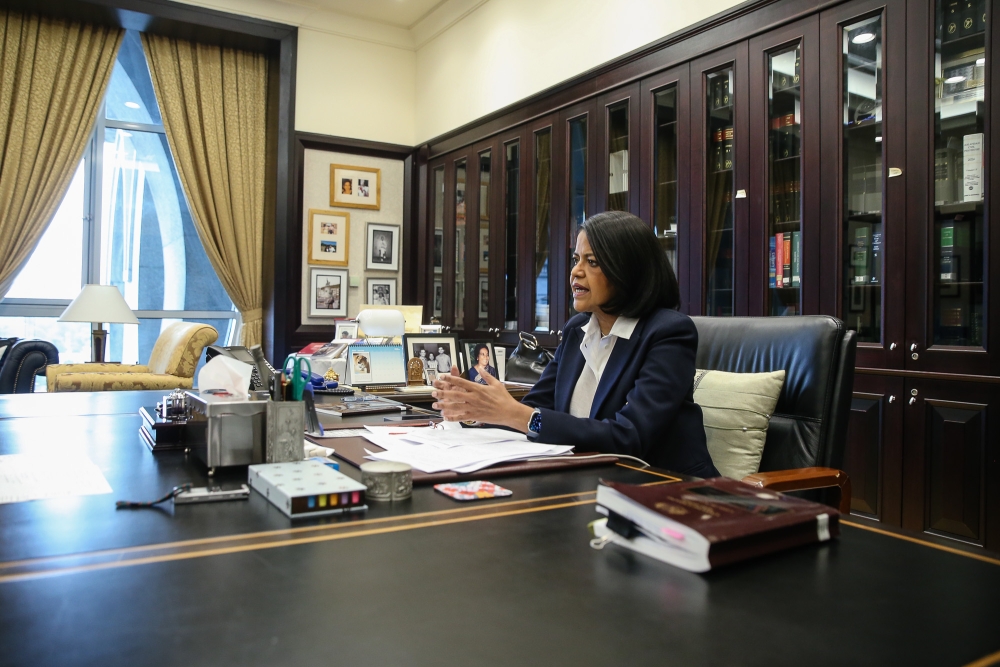 Nallini is seen here at her office at the Palace of Justice, Putrajaya, which features artwork and paintings, as well as photographs of her family including her grandfather Dr K. Thillyampalam. — Picture by Yusof Isa 
