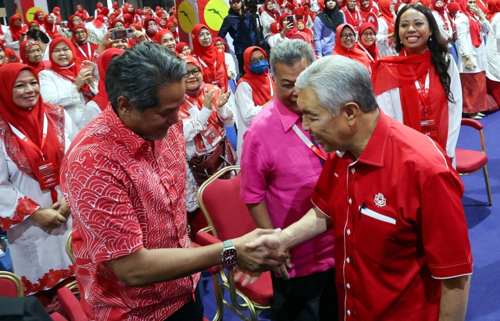 Umno president Datuk Seri Ahmad Zahid Hamidi shaking hands with Rembau Umno deputy chief Khairy Jamaluddin (left) at the World Trade Centre in Kual Lumpur on January 12, 2023. — Bernama pic