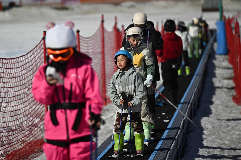 Visitors at Lianhuashan Ski Resort on the outskirts of Beijing on February 16, 2026.— AFP pic