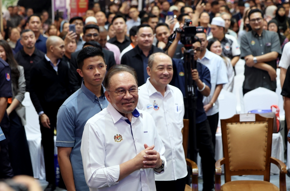 Prime Minister Datuk Seri Anwar Ibrahim arrives to officiate the 2026 National Consumers Day celebration at Suria Sabah in Kota Kinabalu on March 15, 2026. Also present is Sabah Chief Minister Datuk Seri Hajiji Noor. — Bernama pic
