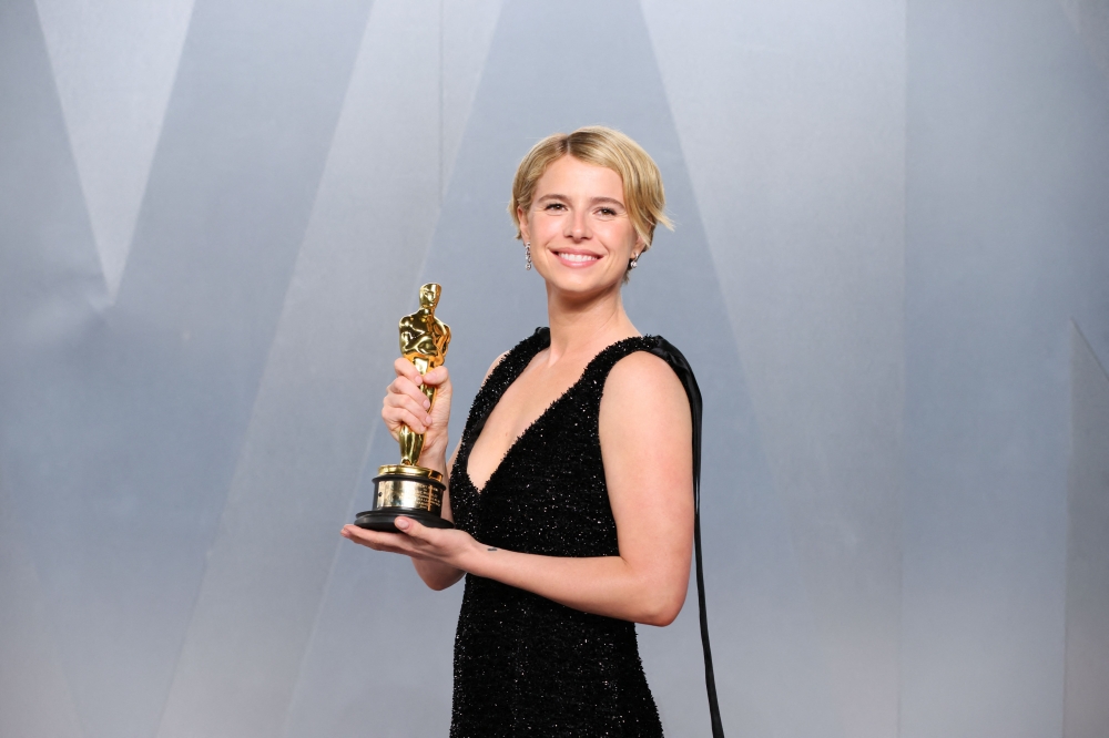 Jessie Buckley holds her Oscar for Best Actress in a Leading Role for ‘Hamnet’ as she attends the Vanity Fair Oscar Party at the Los Angeles County Museum of Art (LACMA) in Los Angeles March 15, 2026. — AFP pic