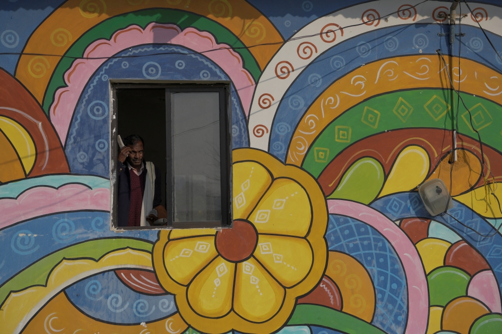 Security guard Pannelal Rajak, 78, prepares to leave in the morning after his night shift at Kenapara Eco Park, which was developed from a closed open‑cast coal‑mine pit into a small tourist hub, in Surajpur, India, November 18, 2025. — Reuters pic