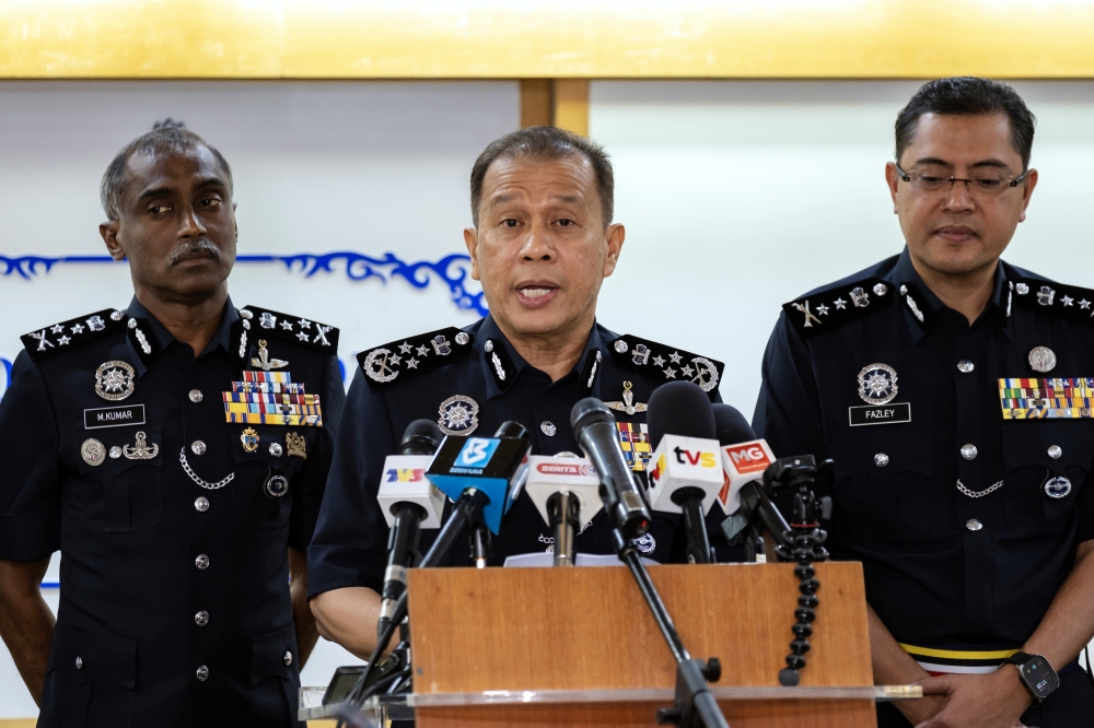 Gemini saidInspector-General of Police Datuk Seri Mohd Khalid Ismail (second, left) speaks during a press conference at the Putrajaya District Police Headquarters on March 16, 2026. — Bernama pic