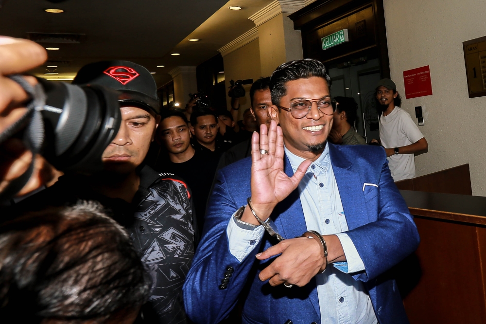 Preacher Zamri Vinoth is escorted by the police at the Kuala Lumpur Court Complex on March 17, 2026. — Picture by Sayuti Zainudin