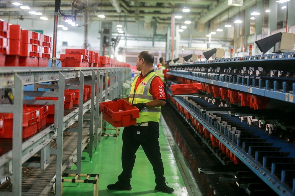 Pos Malaysia Bhd expects parcel volumes to increase by between 15 per cent and 20 per cent during the Hari Raya Aidilfitri period this year compared with ordinary months, driven largely by purchases of Raya clothing and hijabs. — Picture by Sayuti Zainudin