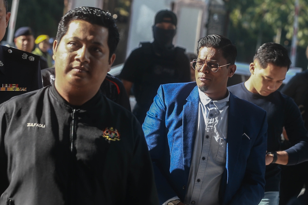 Preacher Zamri Vinoth is brought by the police to the Kuala Lumpur Court Complex on March 17, 2026. — Picture by Sayuti Zainudin