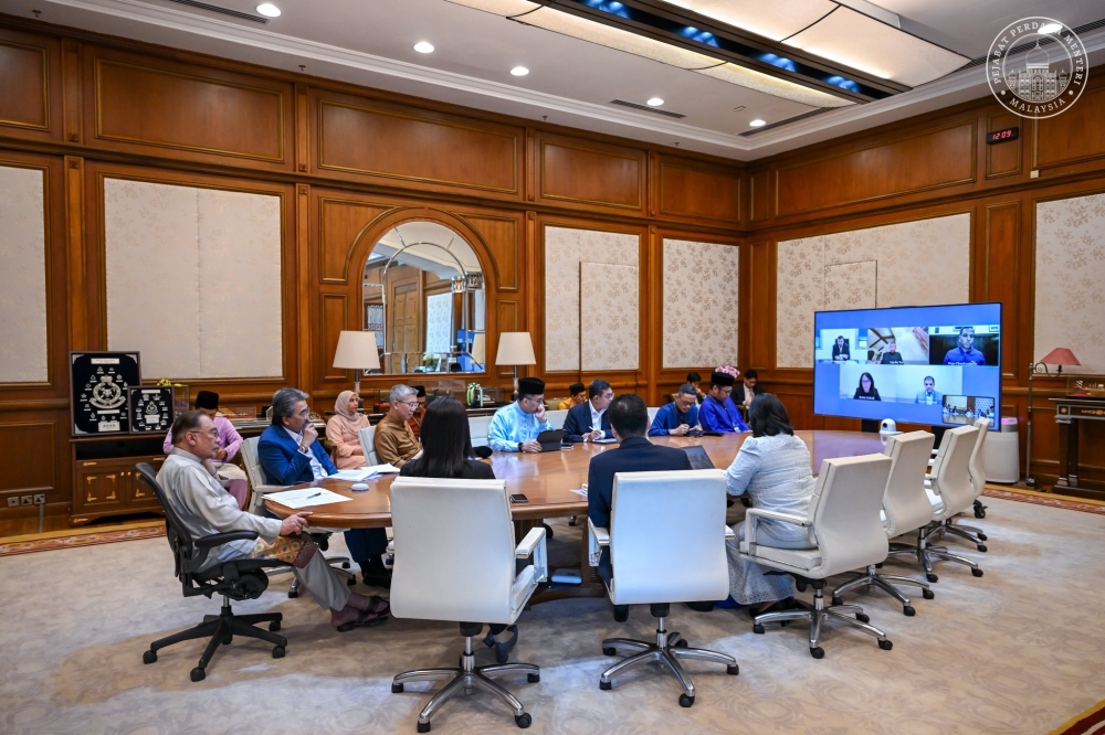 Prime Minister Datuk Seri Anwar Ibrahim and the Malaysian officials in a video conference with Penang-born CEO of tech giant Intel, Tan Lip Bu on the company’s expansion plans. — Picture from Facebook/Anwar Ibrahim
