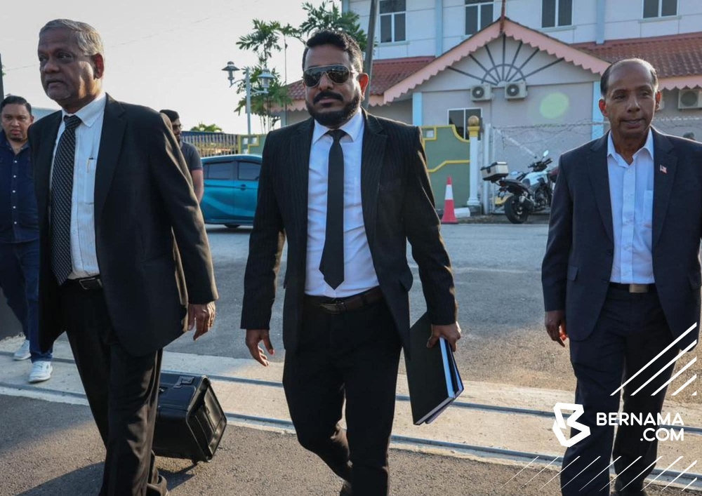 Activist Arun Dorasamy (centre) arrives at the Jawi Magistrate’s Court on March 17, 2026. — Facebook pic