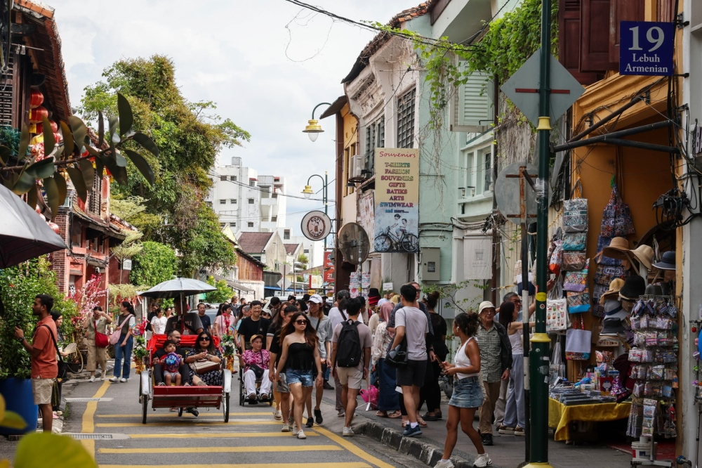 Tourists and visitors are seen at Lebuh Armenian in George Town on December 26, 2025. — Bernama pic