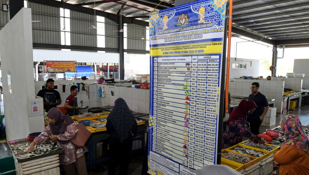 A signboard lists the maximum prices of goods and services controlled by the Domestic Trade and Cost of Living Ministry during the Aidilfitri festive season from March 14 to 28, 2026 at the public wet market in Seberang Perai, Penang. — Bernama pic