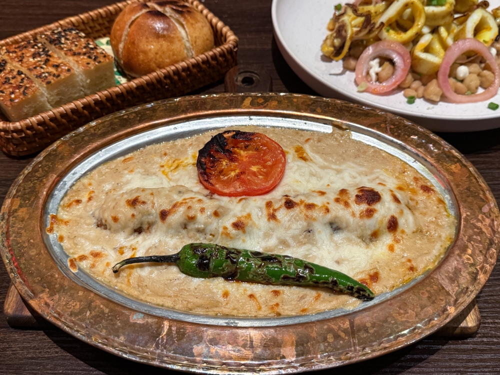 Anatolia Kebab combines juicy lamb ‘kebab’ with creamy eggplant puree covered with a baked cheese topping, and is best eaten with bread. — Picture by Lee Khang Yi