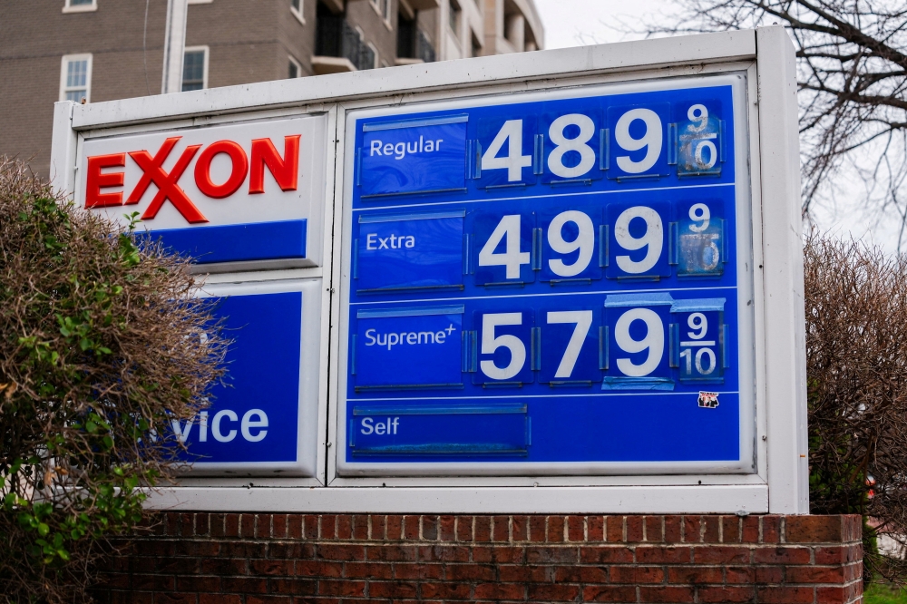 A board displays gas prices amid the ongoing conflict between the United States, Israel, and Iran in Washington D.C. on March 15, 2026. — Reuters pic