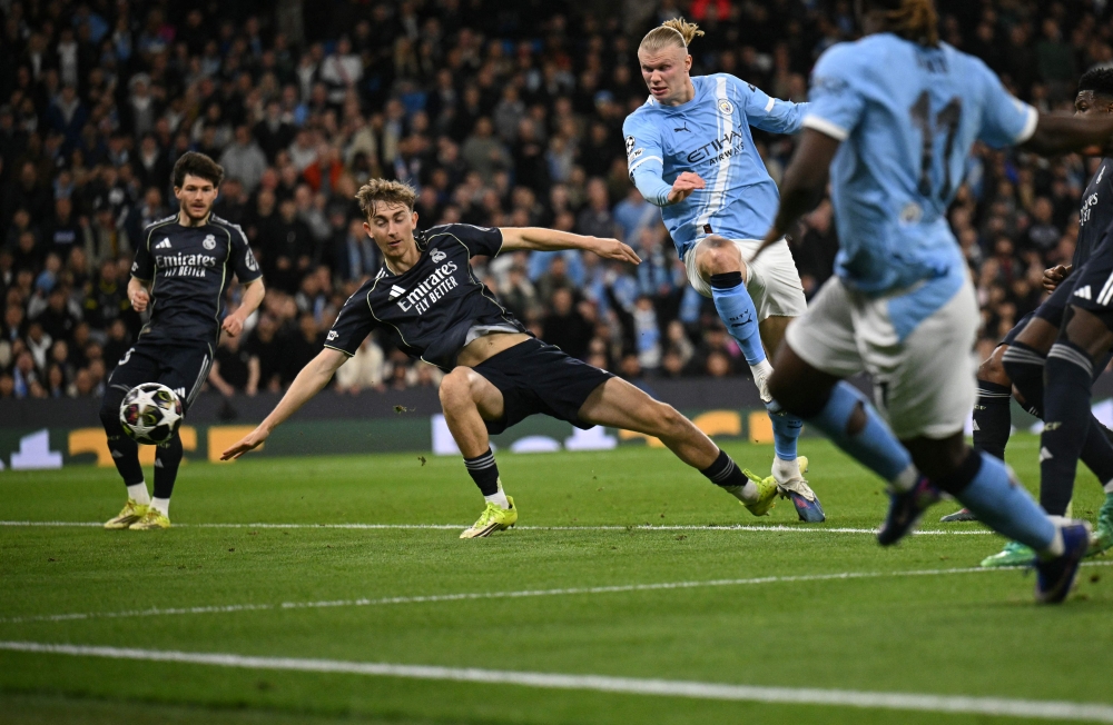 Real Madrid dumped 10-man Manchester City out of the Champions League for the fourth time in five seasons with a 2-1 victory at the Etihad Stadium. — AFP pic