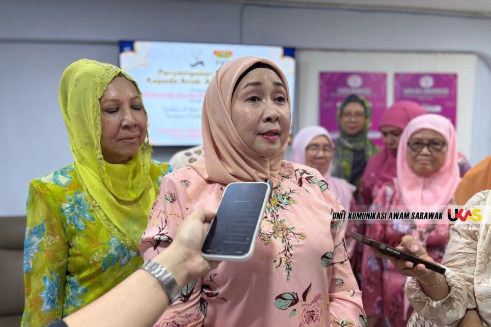 Datuk Sharifah Hasidah Sayeed Aman Ghazali (centre), deputy minister in the Sarawak Premier’s Department (Law, MA63 and State-Federal Relations) speaks to reporters. — Picture courtesy of the Unit Komunikasi Awam Sarawak via The Borneo Post