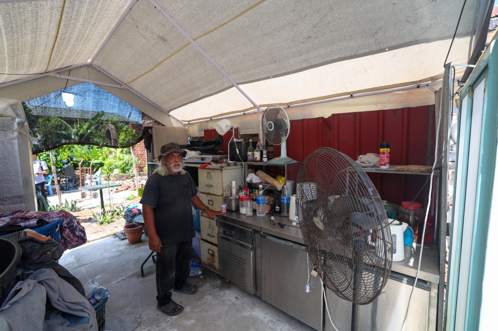 For safety, Mohamad Nasir has taken down what remained of the damaged structure. Yet leaving entirely has never felt like an option — at least not until a new house rises beside it. — Bernama pic