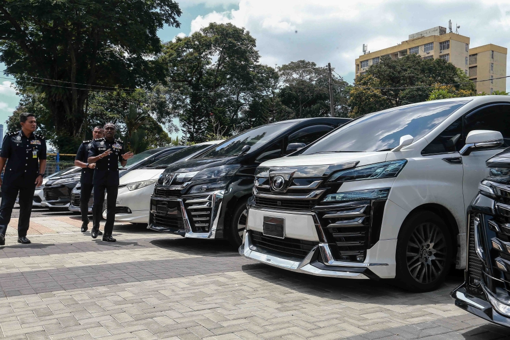 Bukit Aman Criminal Investigation Department Director Datuk M. Kumar displays seized vehicles during a press conference at the Police Training Centre (Pulapol) in Kuala Lumpur on March 18, 2026. — Picture by Sayuti Zainudin